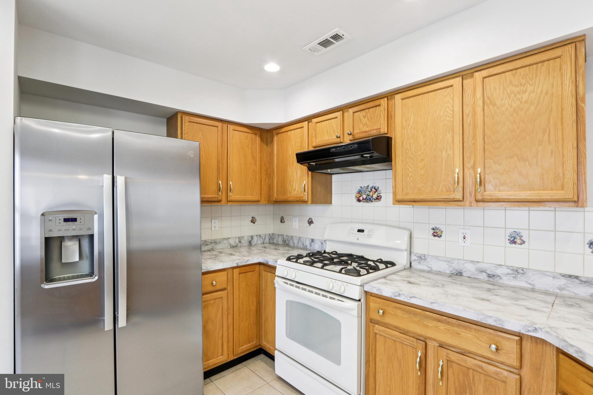 58 Watson Drive Mount Laurel, NJ 08054 - Photo 17 of 56 a kitchen with a refrigerator sink and cabinets