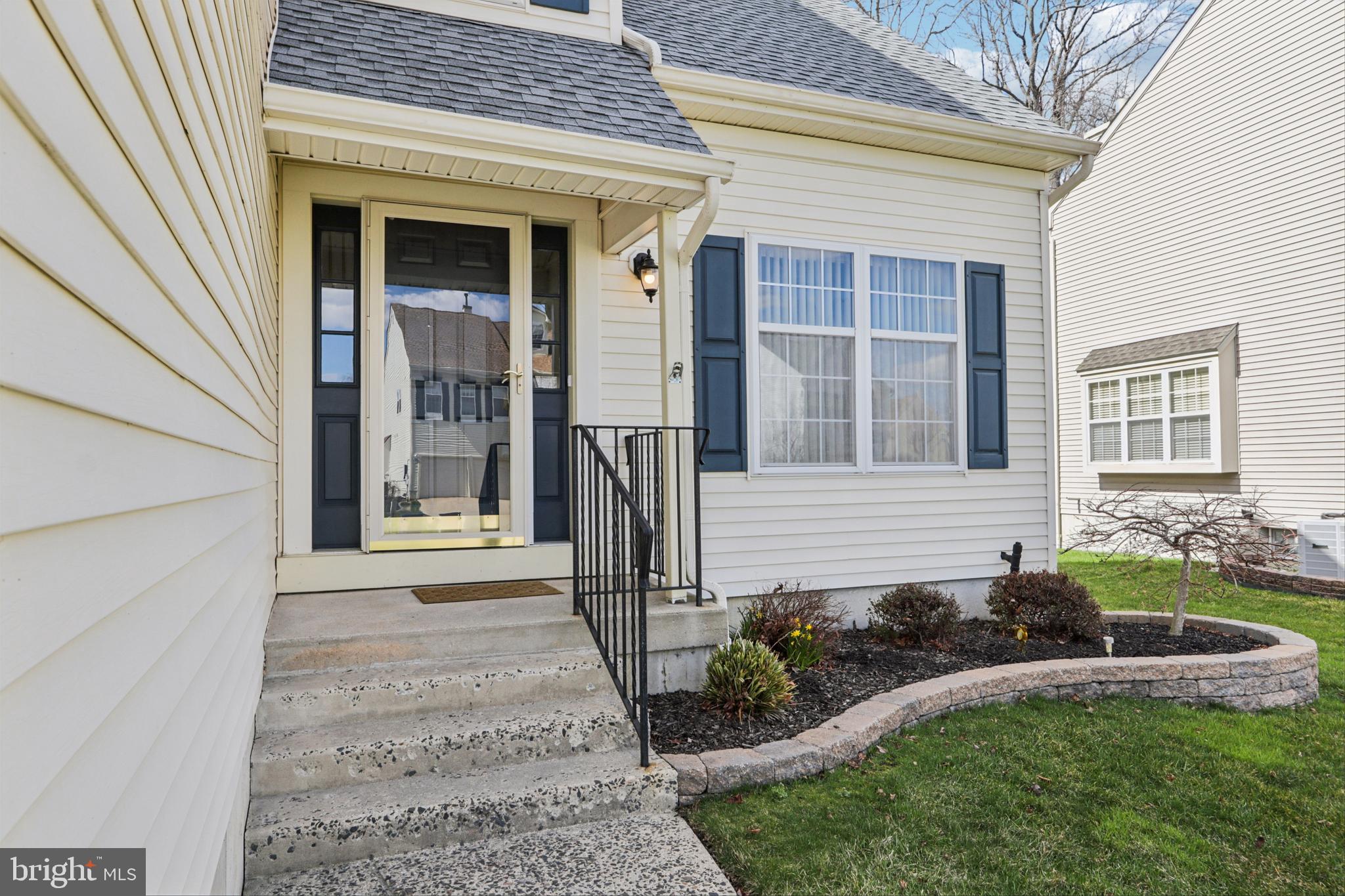 58 Watson Drive Mount Laurel, NJ 08054 - Photo 2 of 56 a front view of a house with a yard outdoor seating and garage