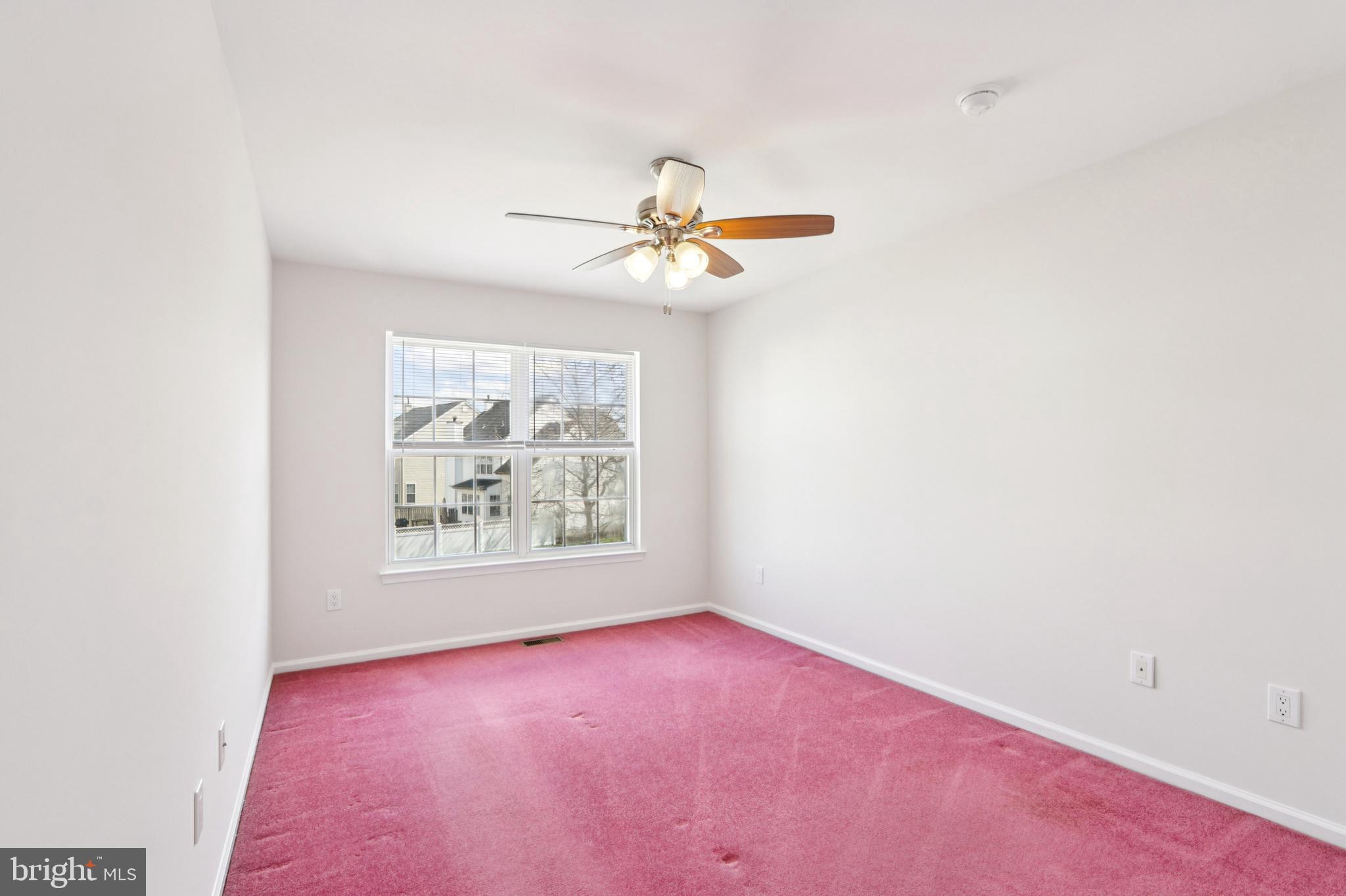 58 Watson Drive Mount Laurel, NJ 08054 - Photo 25 of 56 an empty room with windows and chandelier fan
