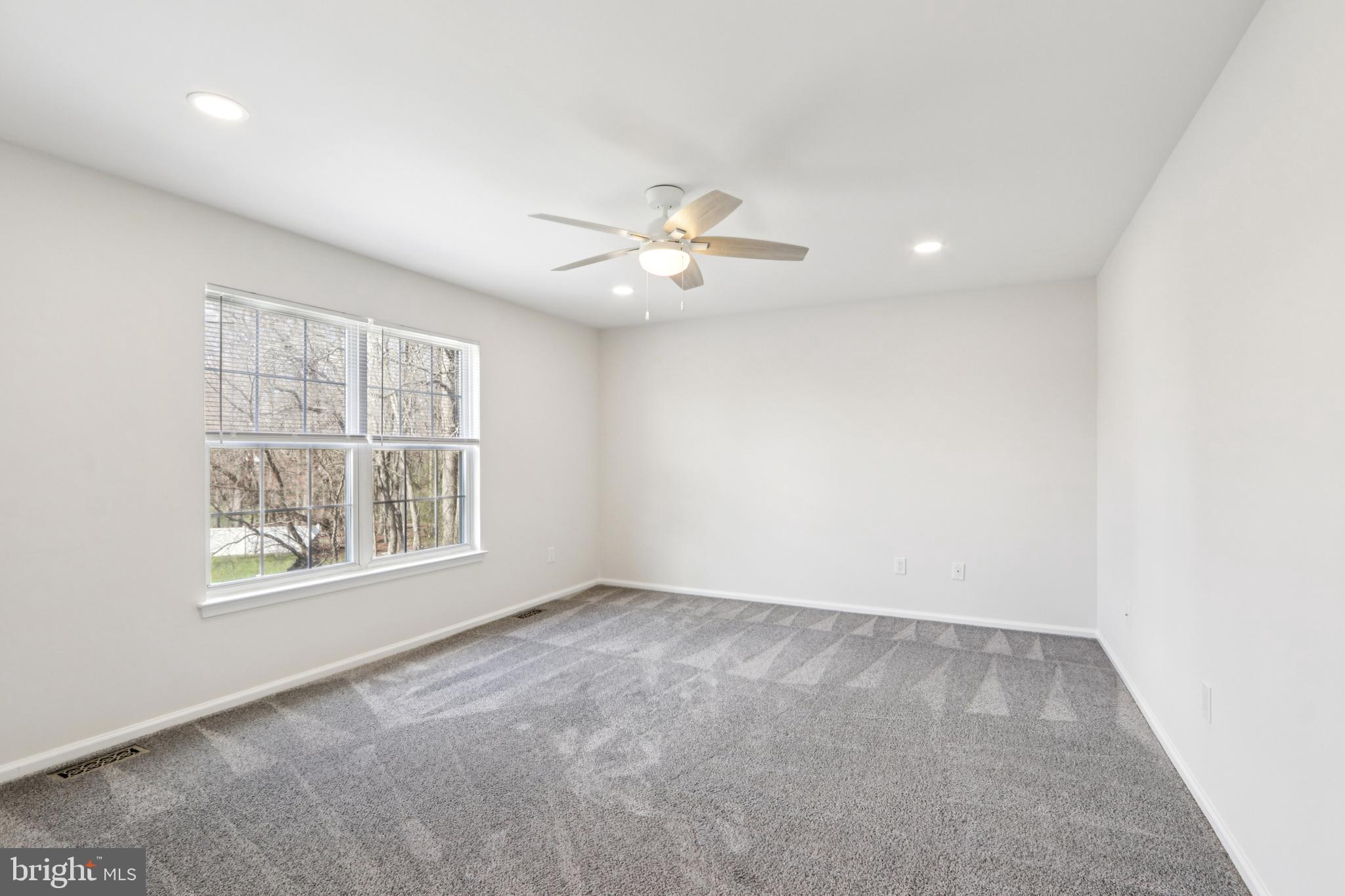 58 Watson Drive Mount Laurel, NJ 08054 - Photo 33 of 56 an empty room with a window and a fan