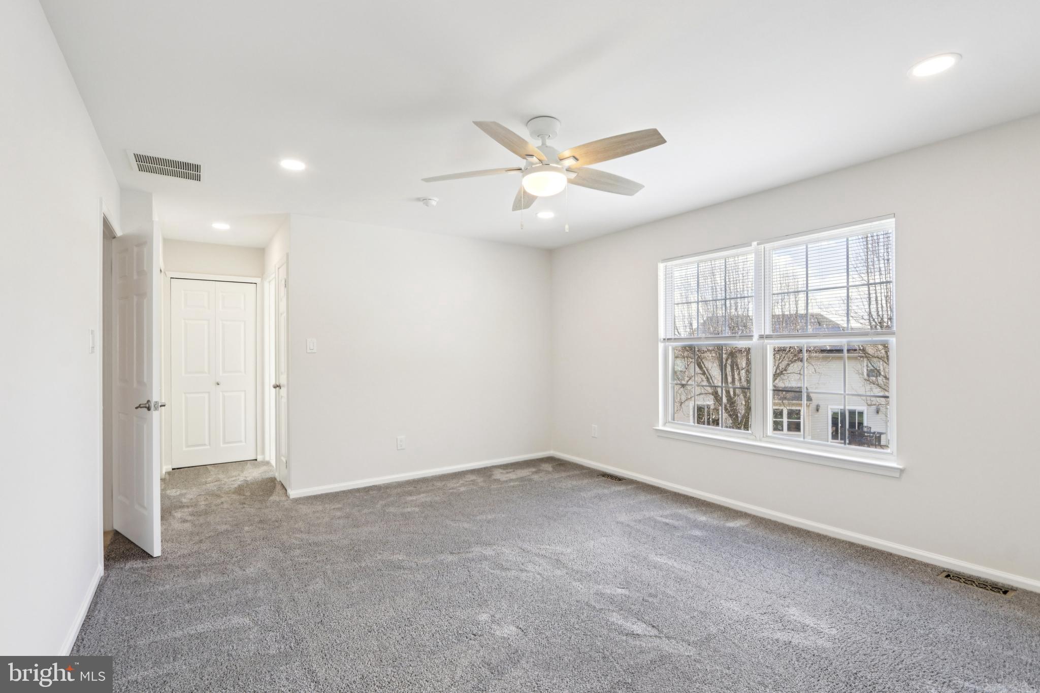 58 Watson Drive Mount Laurel, NJ 08054 - Photo 34 of 56 an empty room with windows and fan
