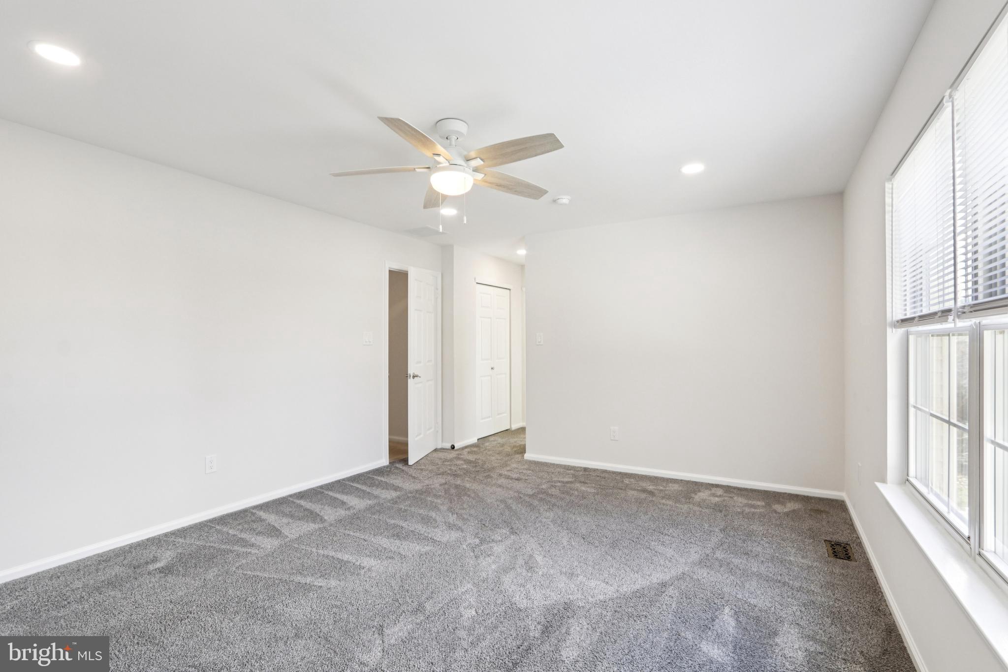 58 Watson Drive Mount Laurel, NJ 08054 - Photo 35 of 56 an empty room with windows and ceiling fan