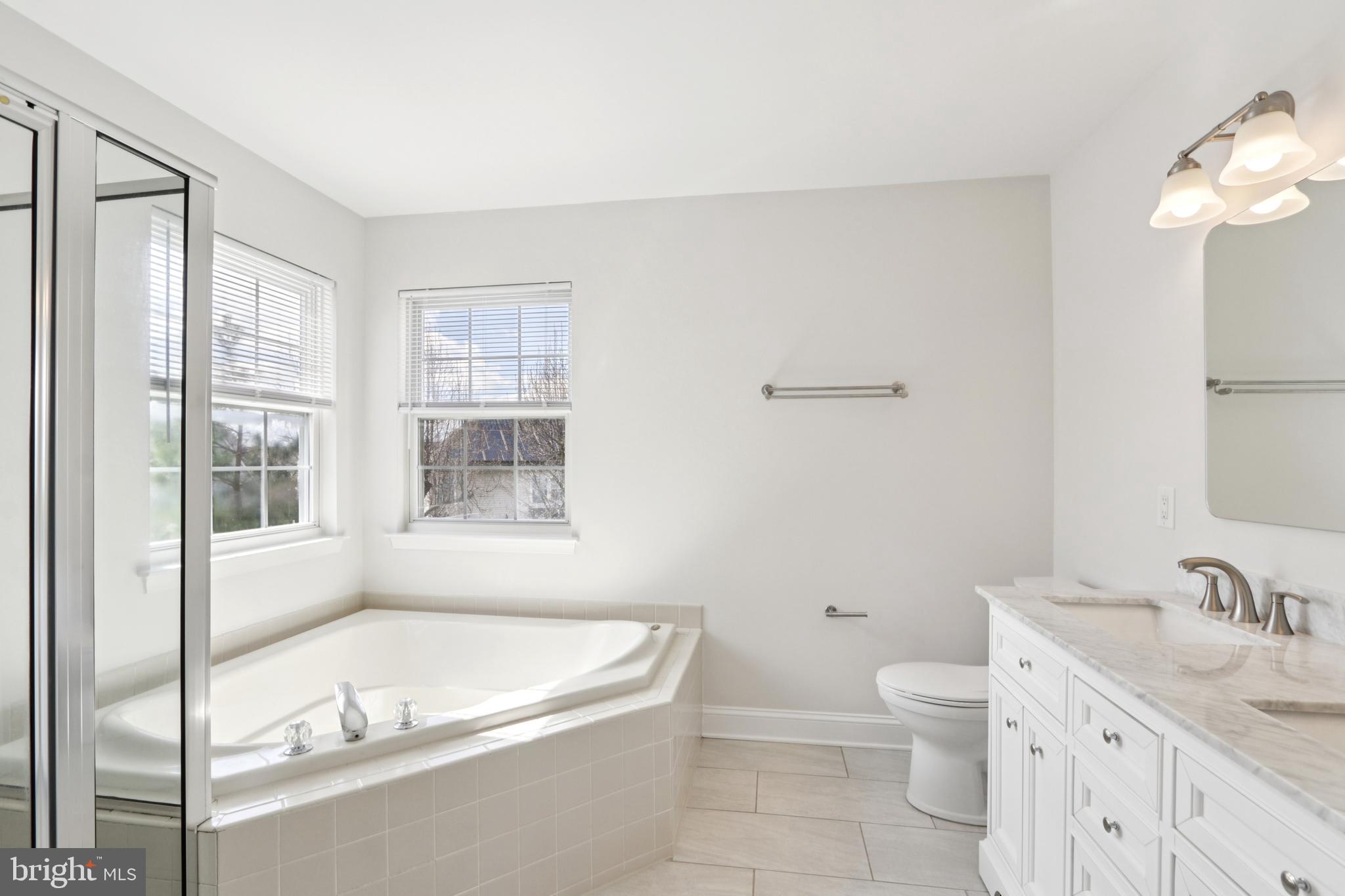 58 Watson Drive Mount Laurel, NJ 08054 - Photo 36 of 56 a bathroom with a granite countertop sink a toilet and bathtub