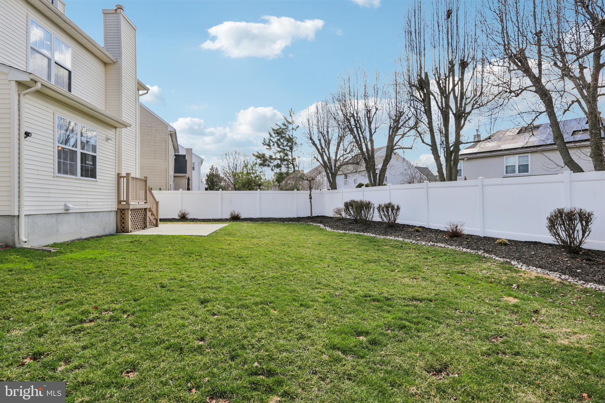 58 Watson Drive Mount Laurel, NJ 08054 - Photo 45 of 56 a view of a backyard with a large tree