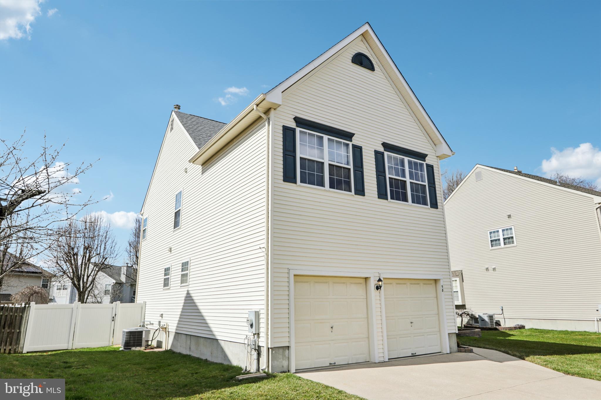 58 Watson Drive Mount Laurel, NJ 08054 - Photo 52 of 56 a view of a white house next to a yard