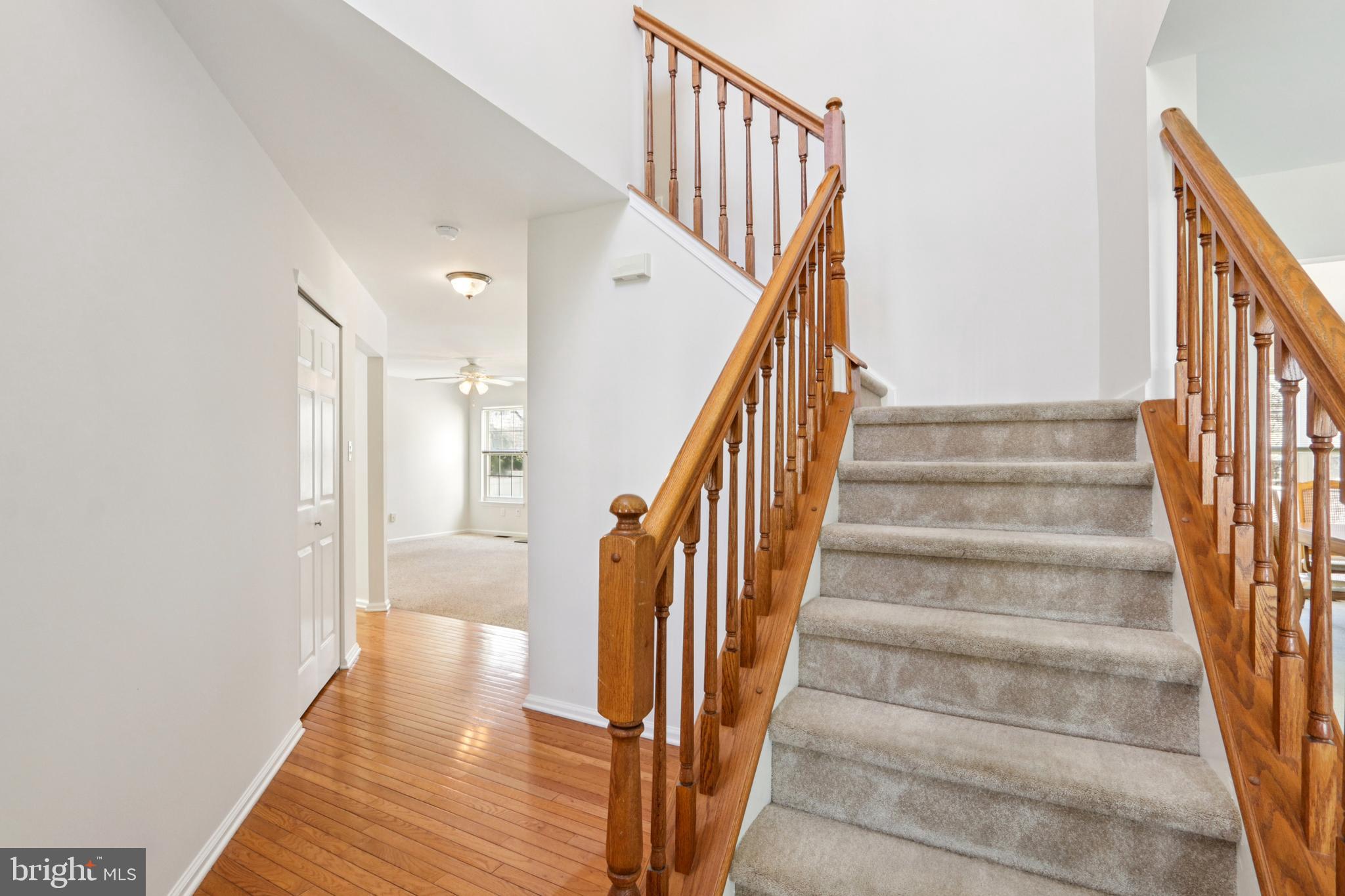 58 Watson Drive Mount Laurel, NJ 08054 - Photo 6 of 56 a view of staircase with lots of frames on wall and wooden floor