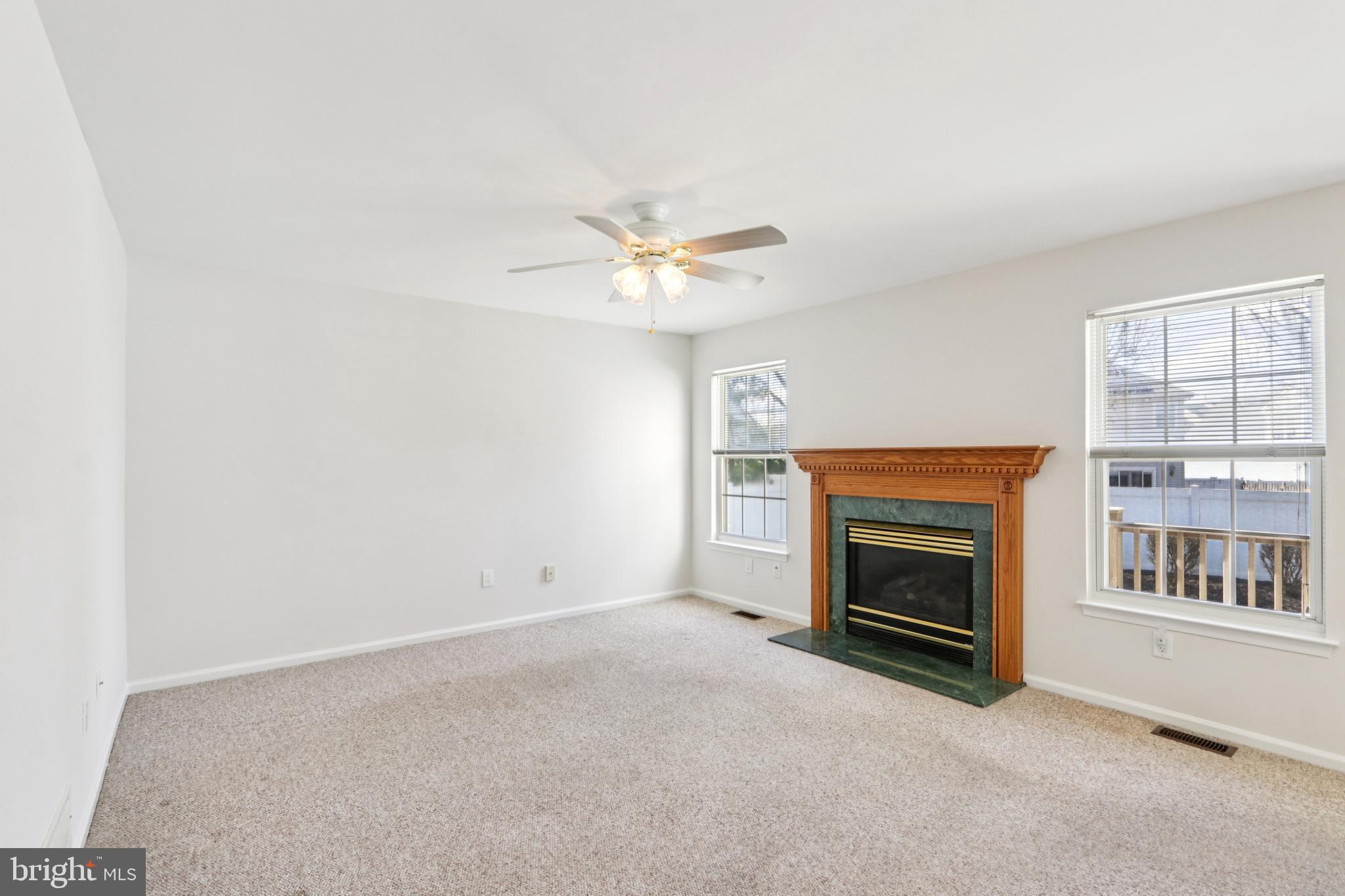 58 Watson Drive Mount Laurel, NJ 08054 - Photo 8 of 56 an empty room with fireplace and fan