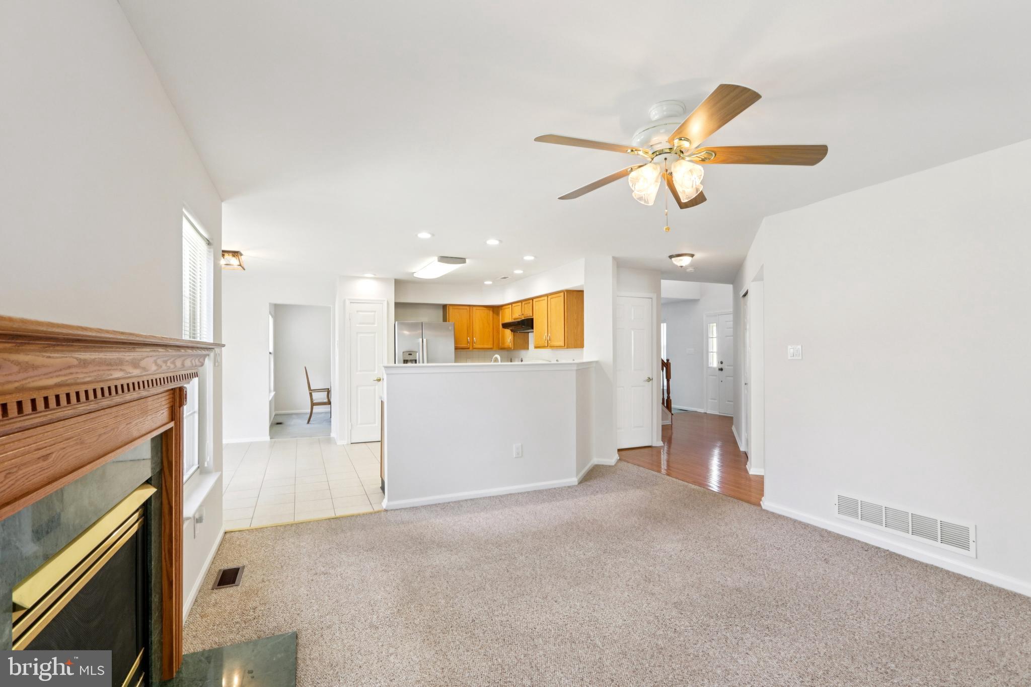 58 Watson Drive Mount Laurel, NJ 08054 - Photo 10 of 56 a view of a livingroom with a fireplace and ceiling fan