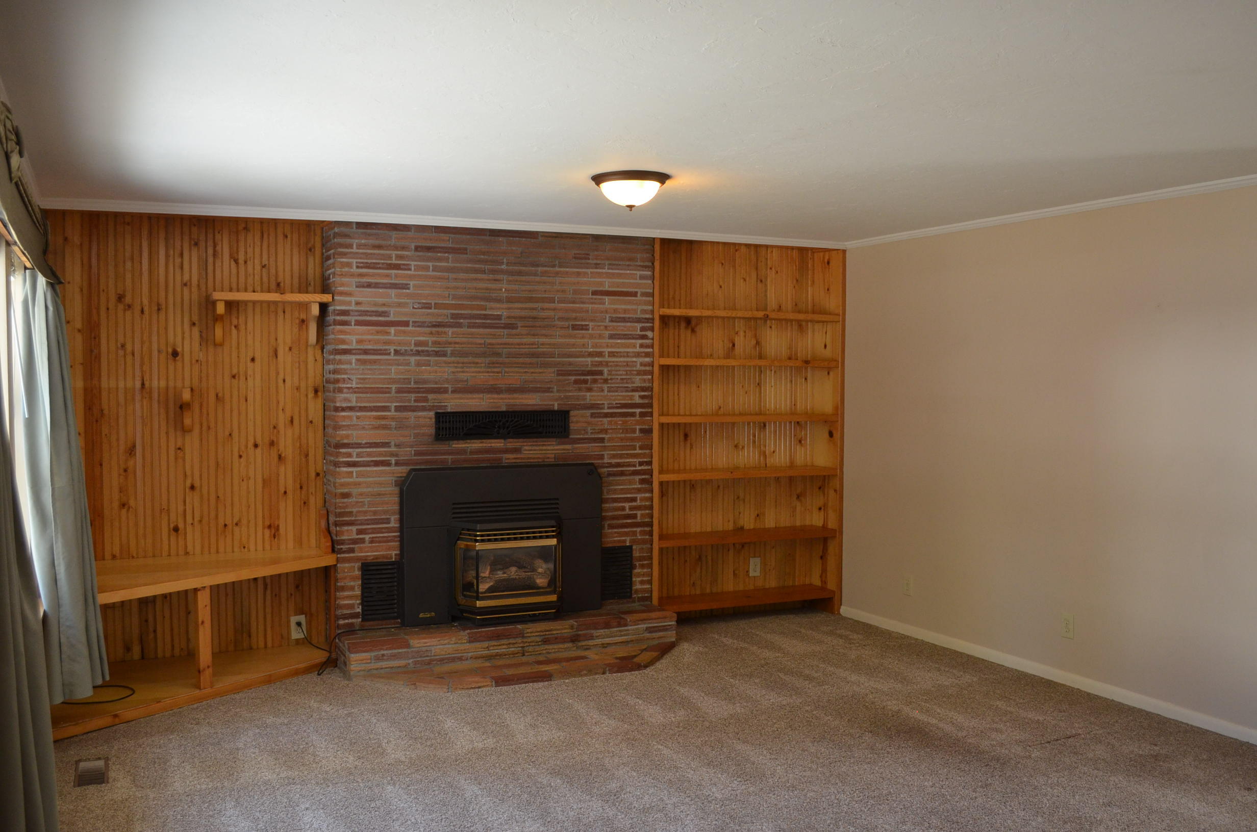 137008 Main Street Crescent, OR 97733 - Photo 4 of 50 an empty room with a fireplace