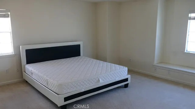 a bathroom with a granite countertop sink a mirror and a shower