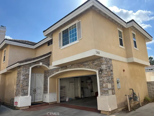 a view of an empty room with furniture window and fire place