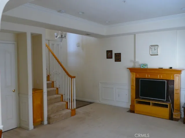 a kitchen with kitchen island a counter top space a sink stainless steel appliances and cabinets