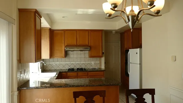 a close view of sink and cabinets