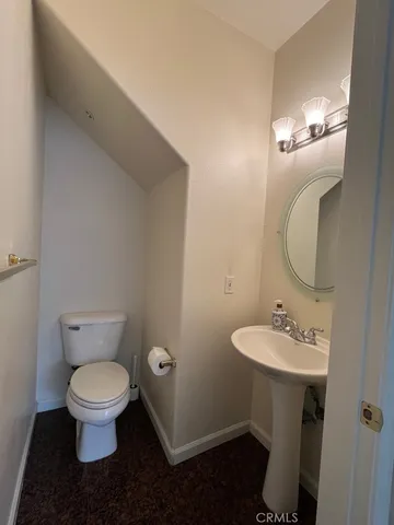 a kitchen with a sink a window and cabinets