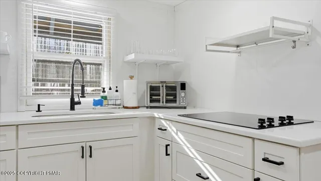 a view of a chairs and tables in the balcony