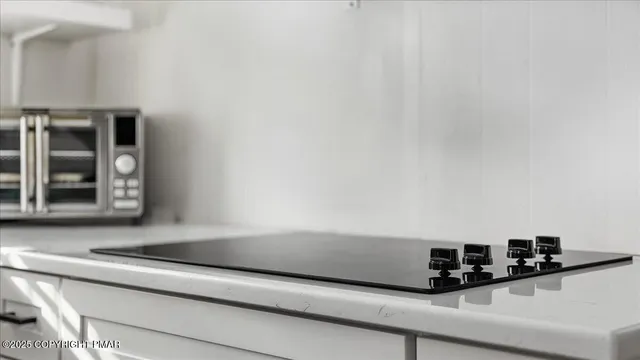 a view of a house with a bench in the patio