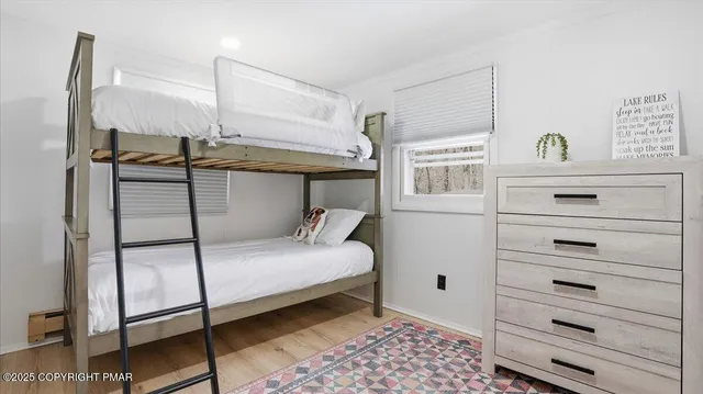 a view of a house with a yard covered with snow
