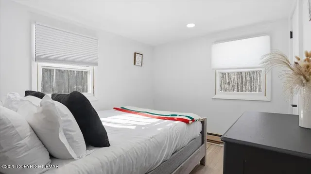 a picture of a bench in front of a wall