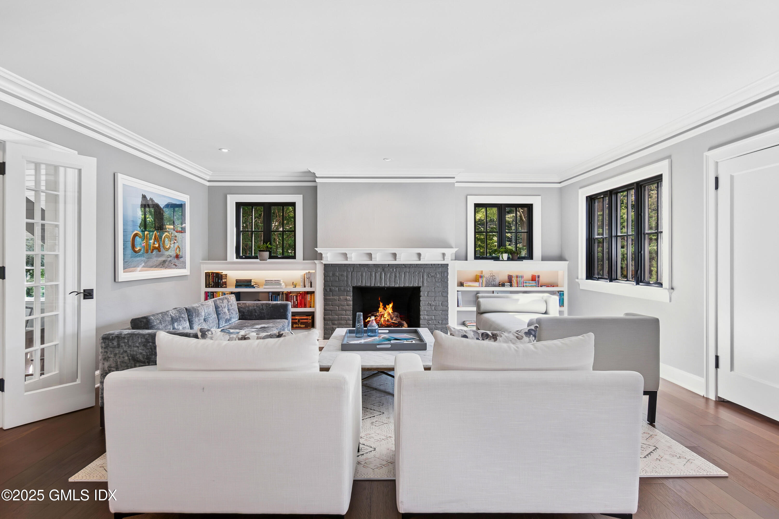 87 Orchard Drive Greenwich, CT 06830 - Photo 13 of 31 a living room with furniture a fireplace and a window