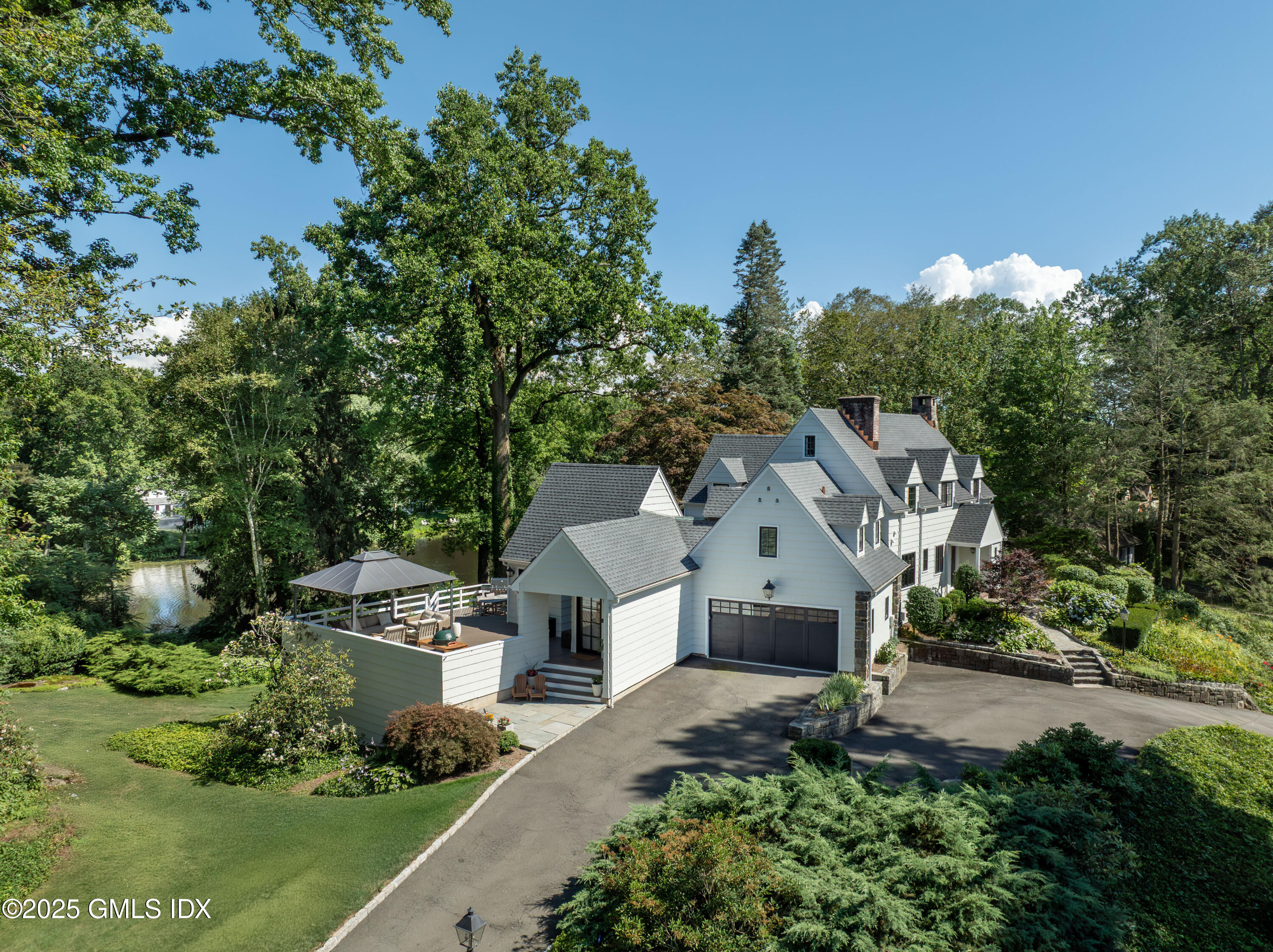 87 Orchard Drive Greenwich, CT 06830 - Photo 28 of 31 an aerial view of a house with swimming pool and garden