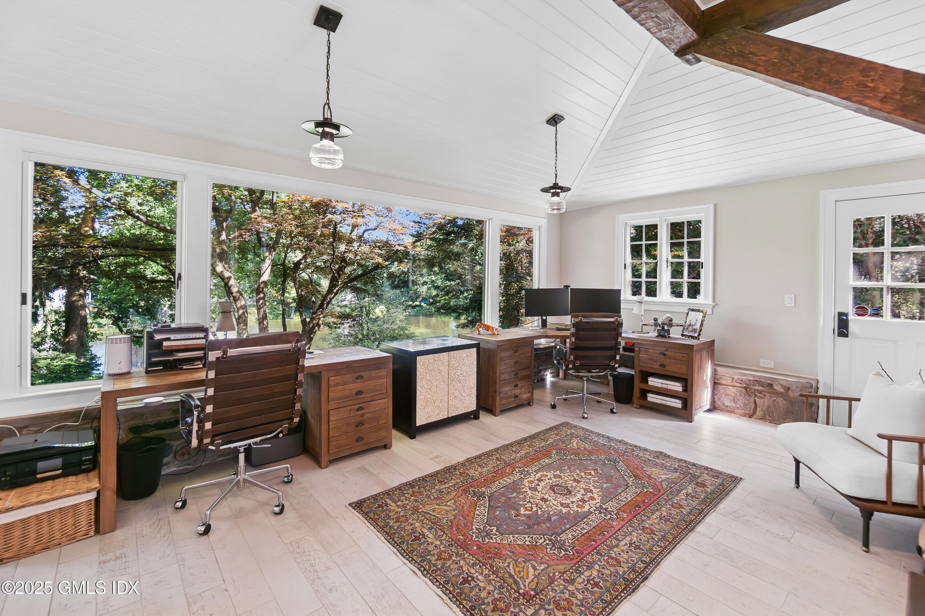 87 Orchard Drive Greenwich, CT 06830 - Photo 10 of 31 a living room with furniture a window and a table