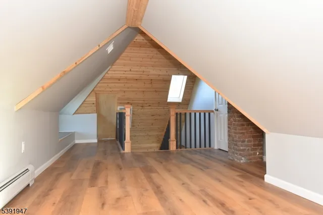 a bathroom with a sink toilet a mirror and shower