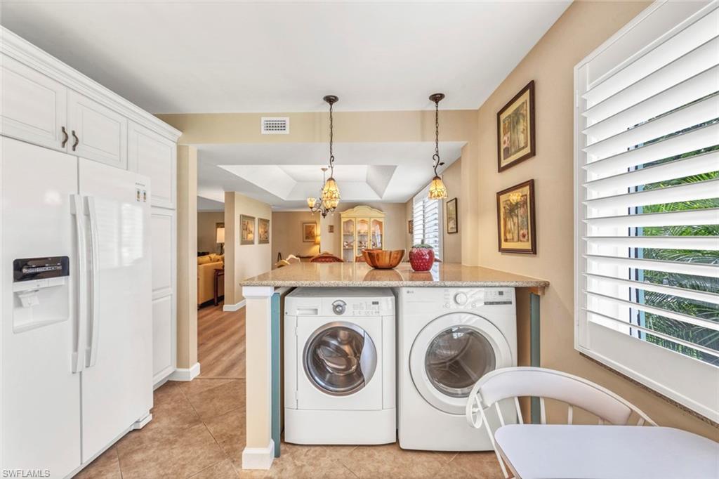 245 Quails Nest Road, Unit 3 Naples, FL 34112 - Photo 13 of 50 a view of a hallway with washer and dryer