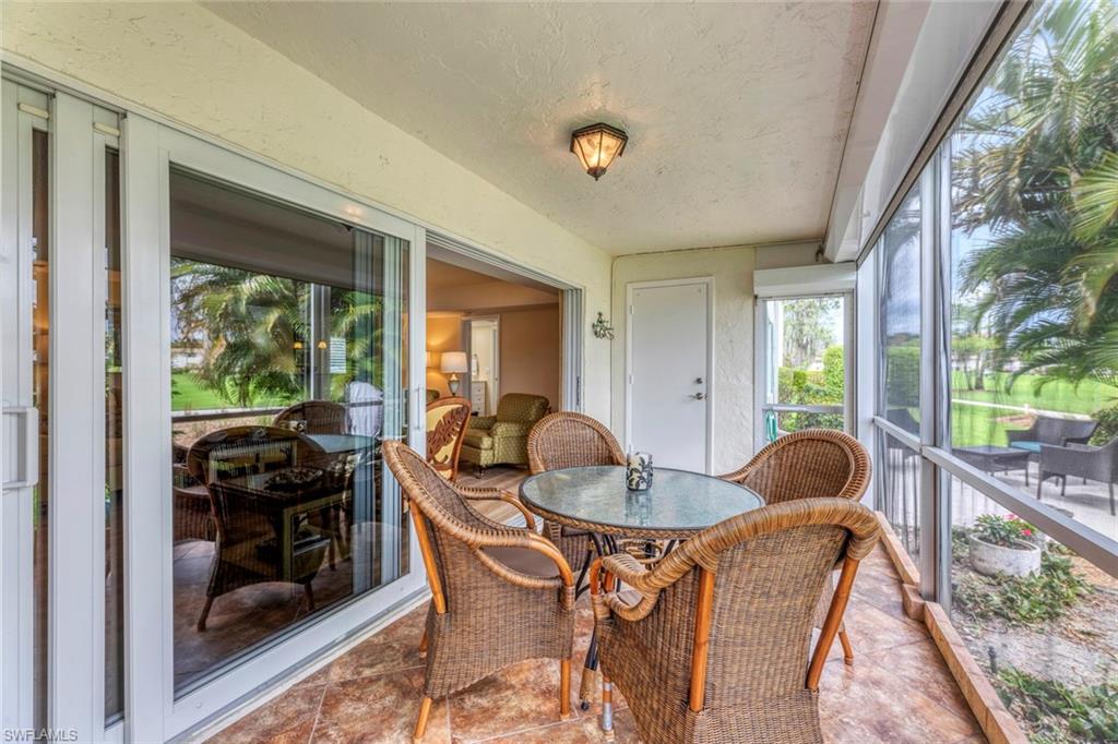 245 Quails Nest Road, Unit 3 Naples, FL 34112 - Photo 32 of 50 a dining room with furniture and wooden floor