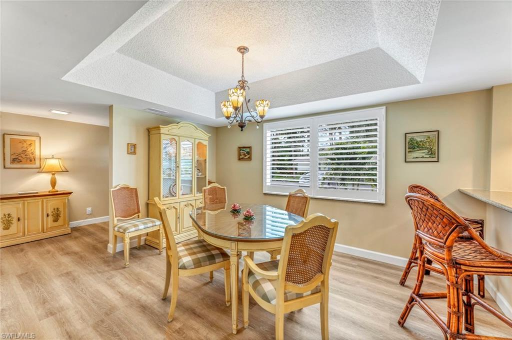245 Quails Nest Road, Unit 3 Naples, FL 34112 - Photo 7 of 50 a dining room with furniture and window