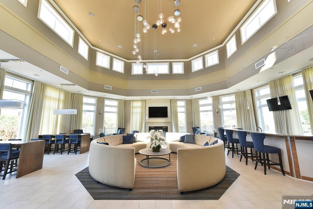 200 Dey Street, Unit 231 Harrison, NJ 07029 - Photo 15 of 19 a living room with fireplace furniture and a large window