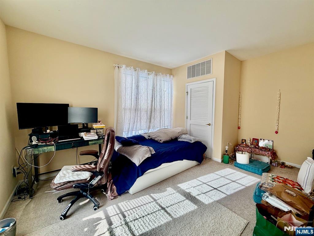 200 Dey Street, Unit 231 Harrison, NJ 07029 - Photo 10 of 19 a bedroom with a workspace