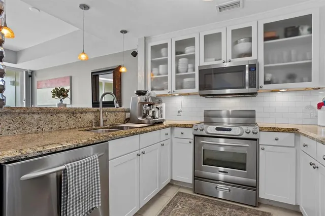 a view of a balcony with chair and a potted plant