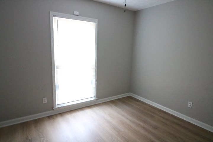 7935 Crescent Drive Columbus, GA 31909 - Photo 15 of 16 an empty room with wooden floor and windows