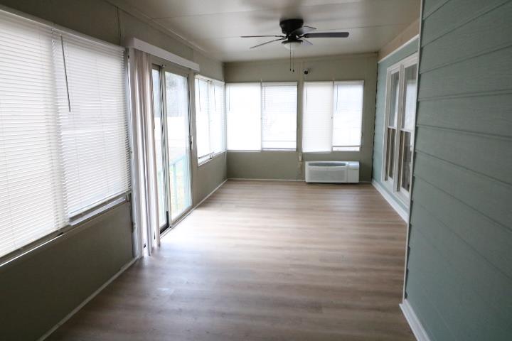 7935 Crescent Drive Columbus, GA 31909 - Photo 8 of 16 a view of hallway with window and wooden floor