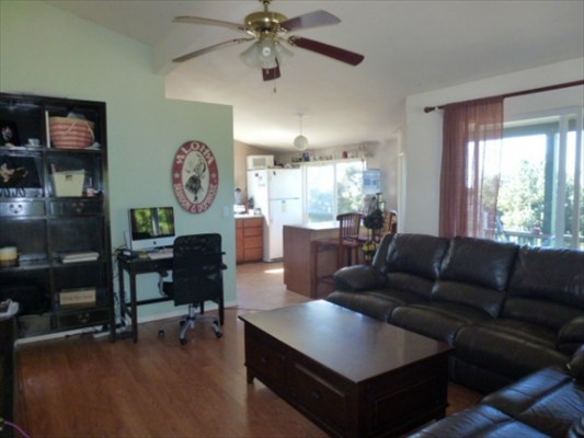 82-1225 Kinue Road Captain Cook, HI 96704 - Photo 19 of 25 a living room with furniture and a large window