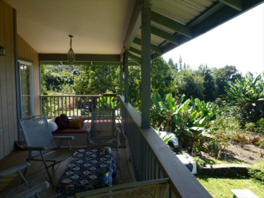 82-1225 Kinue Road Captain Cook, HI 96704 - Photo 4 of 25 a view of a chairs and table in backyard