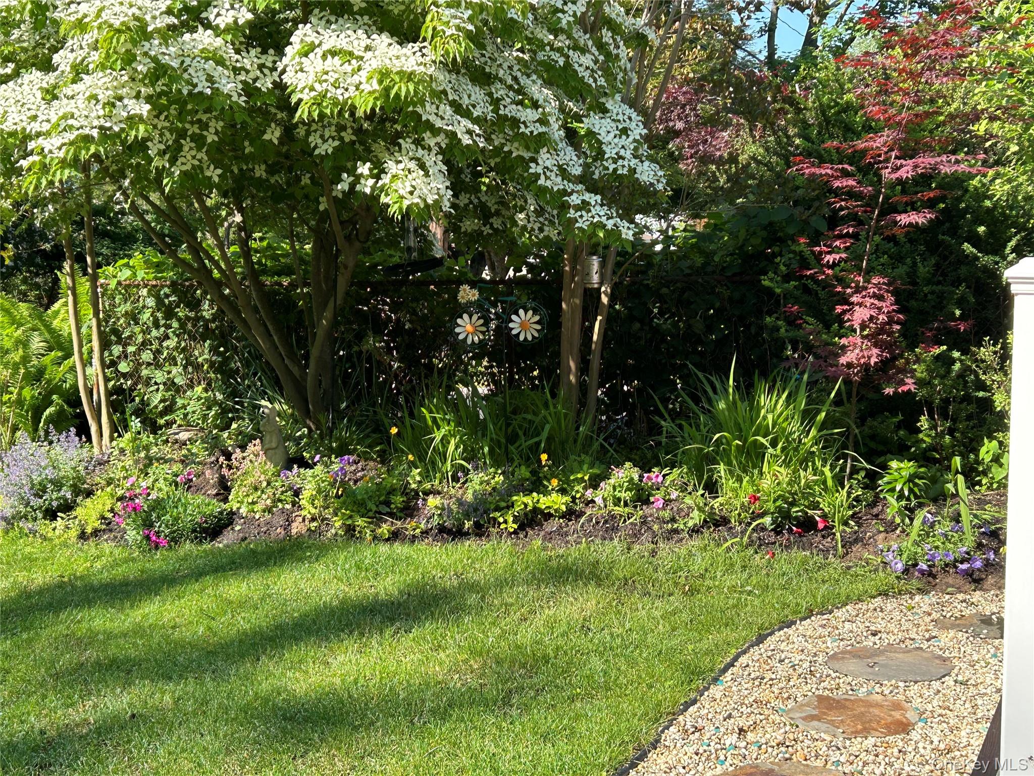 41 Narcissus Road Kings Park, NY 11754 - Photo 29 of 29 Front yard near Adirondack chairs...