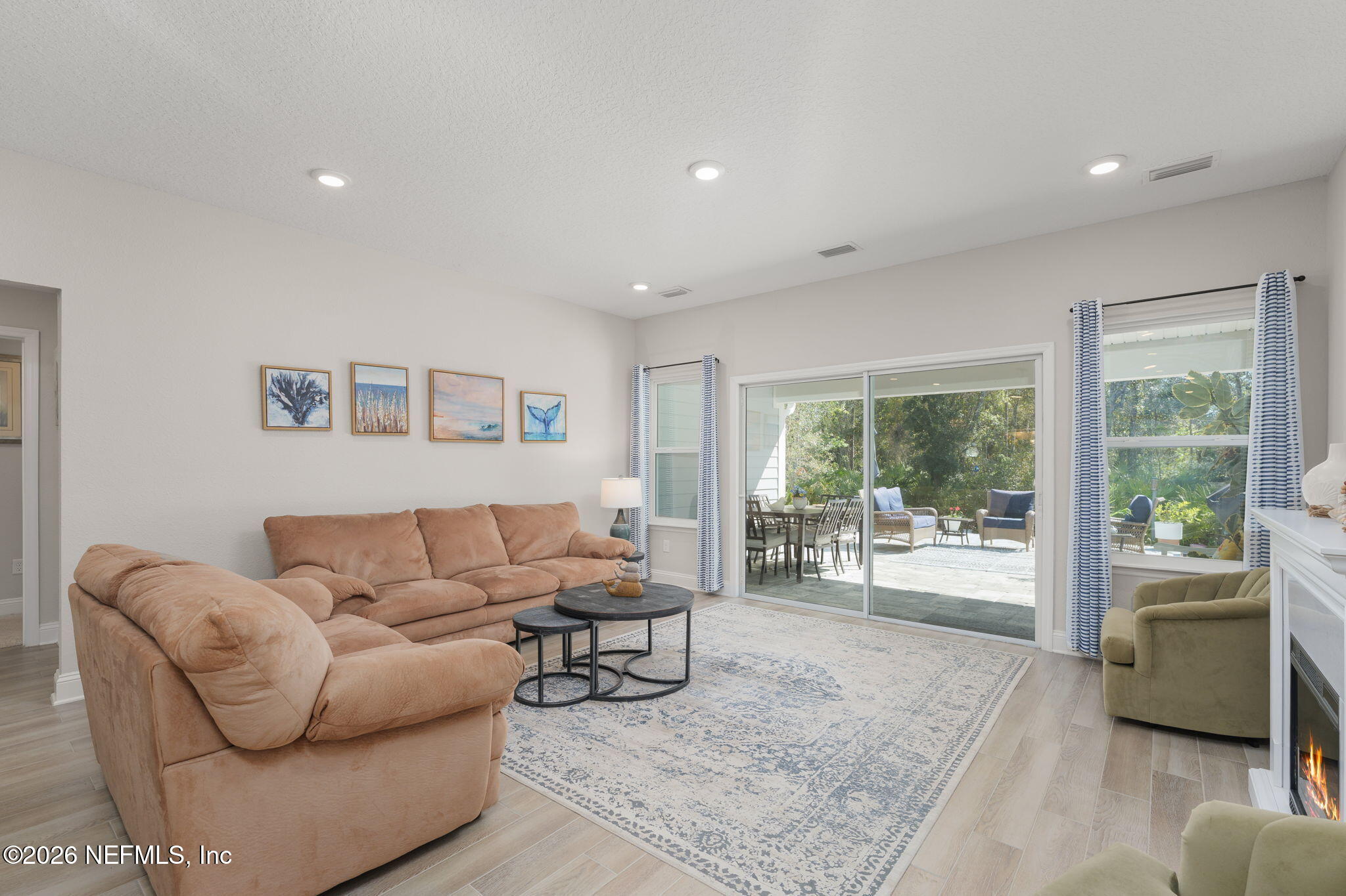 103 Riva Ridge Place St. Johns, FL 32259 - Photo 13 of 77 a living room with furniture and a large window