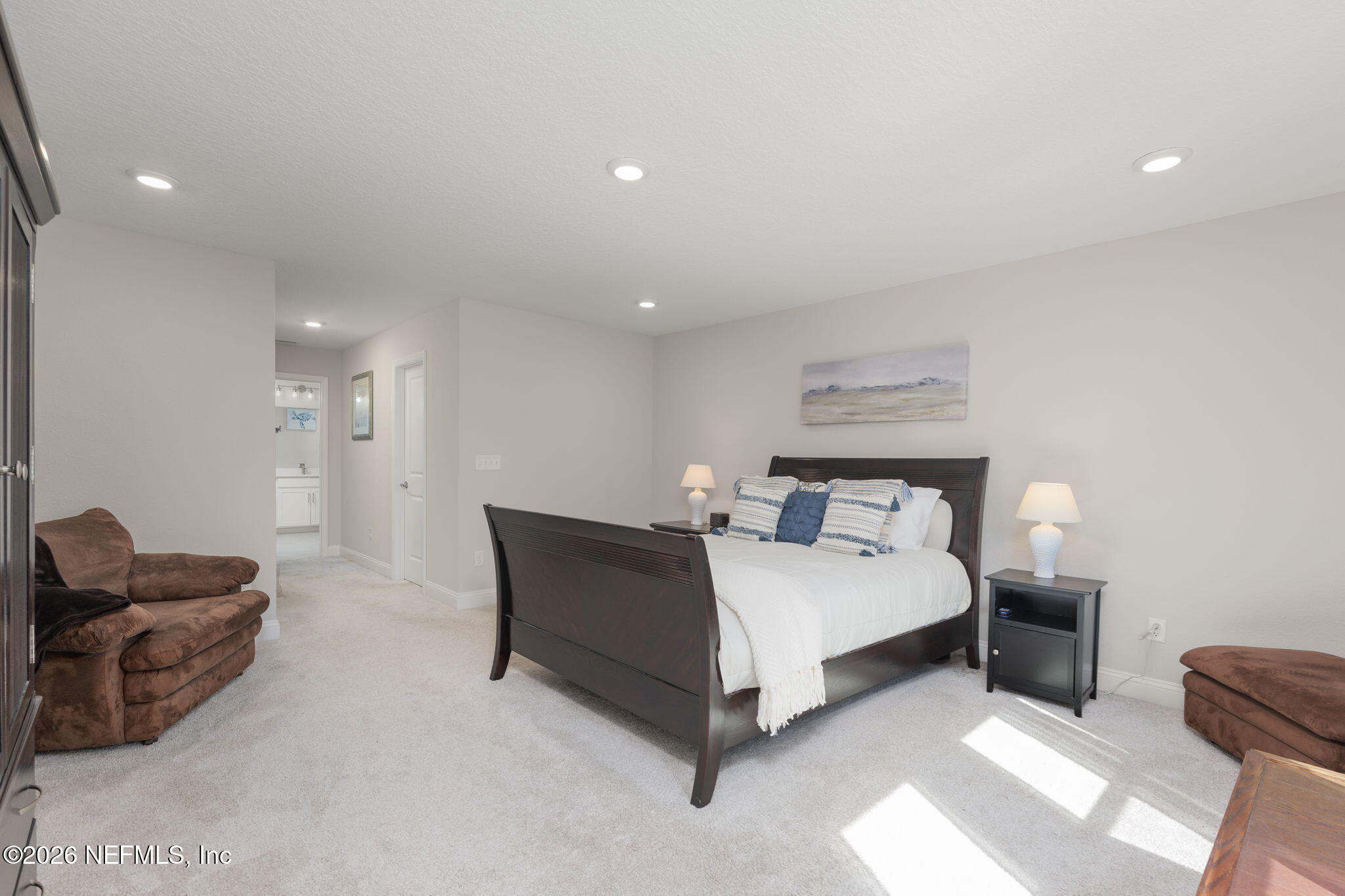 103 Riva Ridge Place St. Johns, FL 32259 - Photo 14 of 77 a spacious bedroom with a bed and a couch
