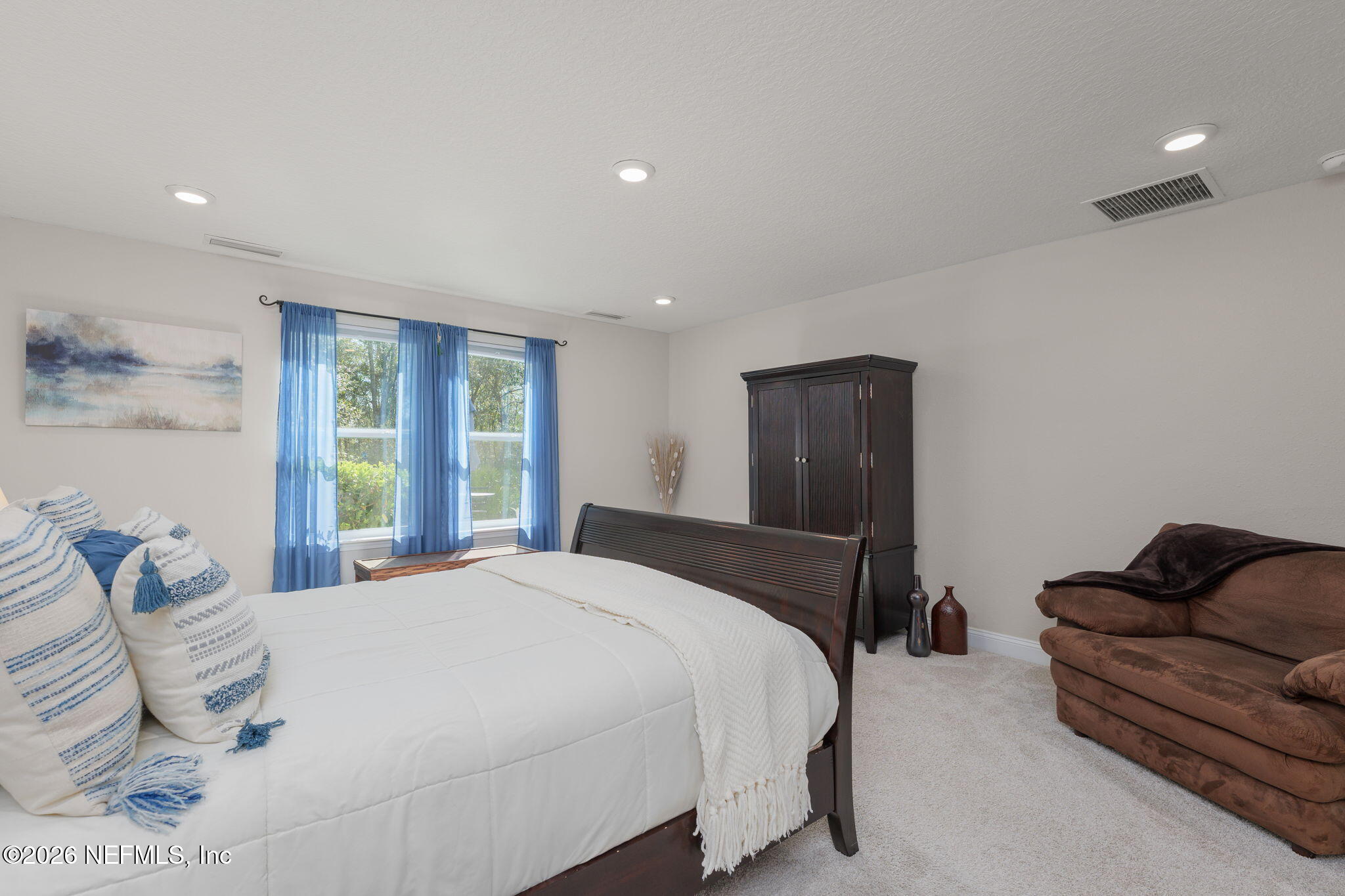 103 Riva Ridge Place St. Johns, FL 32259 - Photo 15 of 77 a bedroom with a bed and wooden floor