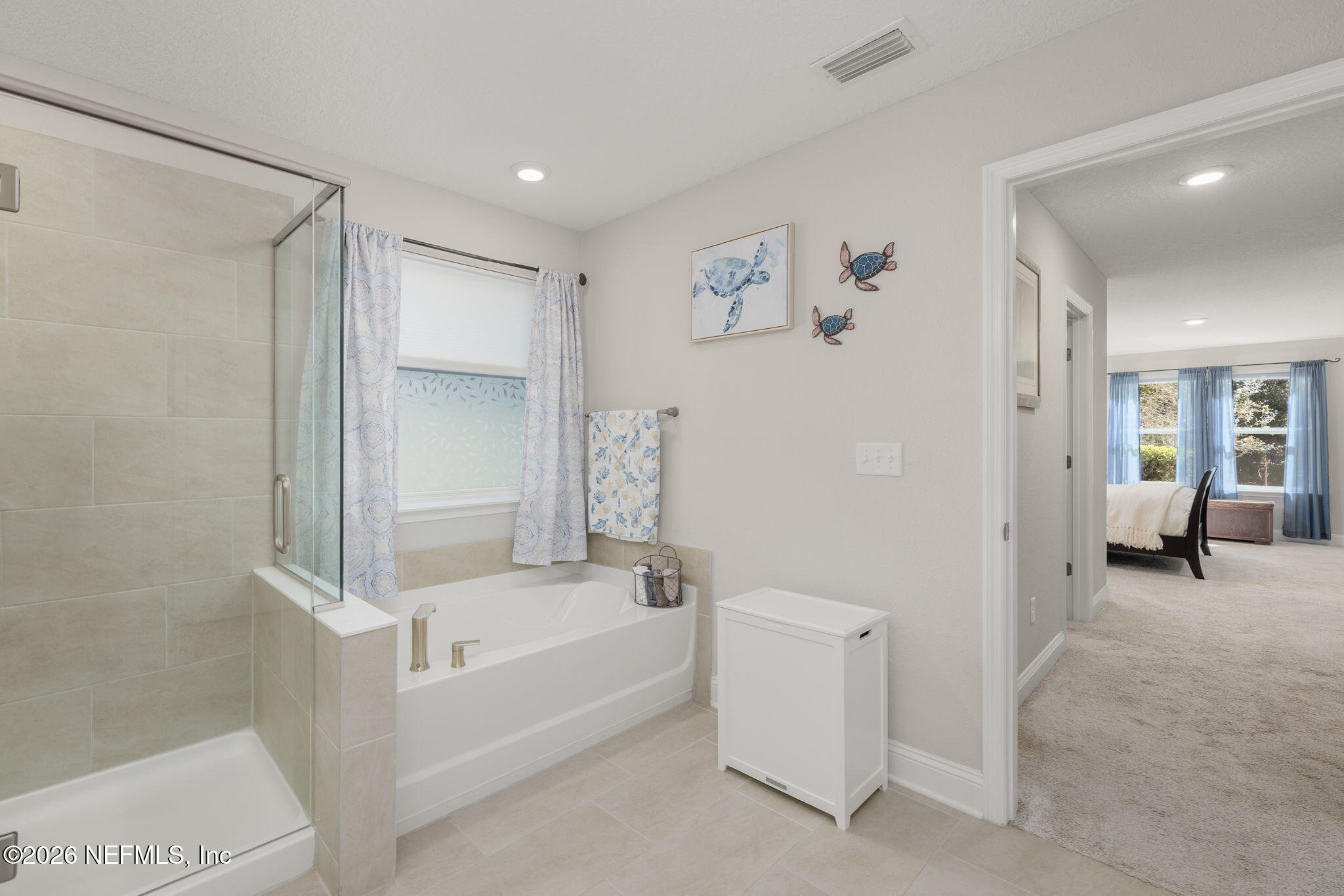 103 Riva Ridge Place St. Johns, FL 32259 - Photo 17 of 77 a bathroom with a bathtub and a shower
