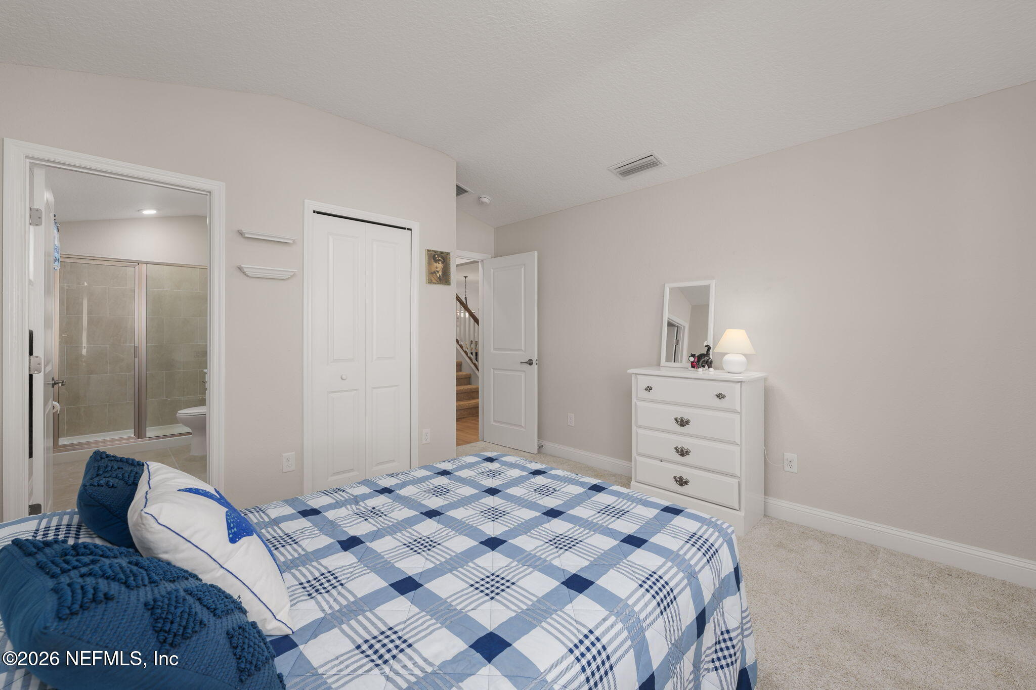 103 Riva Ridge Place St. Johns, FL 32259 - Photo 20 of 77 a bedroom with a bed and a dresser