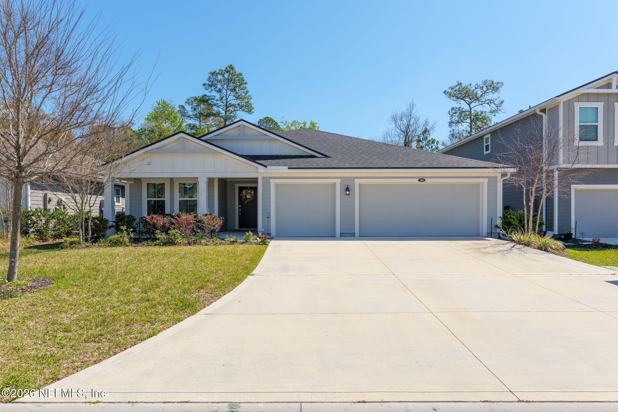 103 Riva Ridge Place St. Johns, FL 32259 - Photo 2 of 77 a front view of a house with a yard and garage