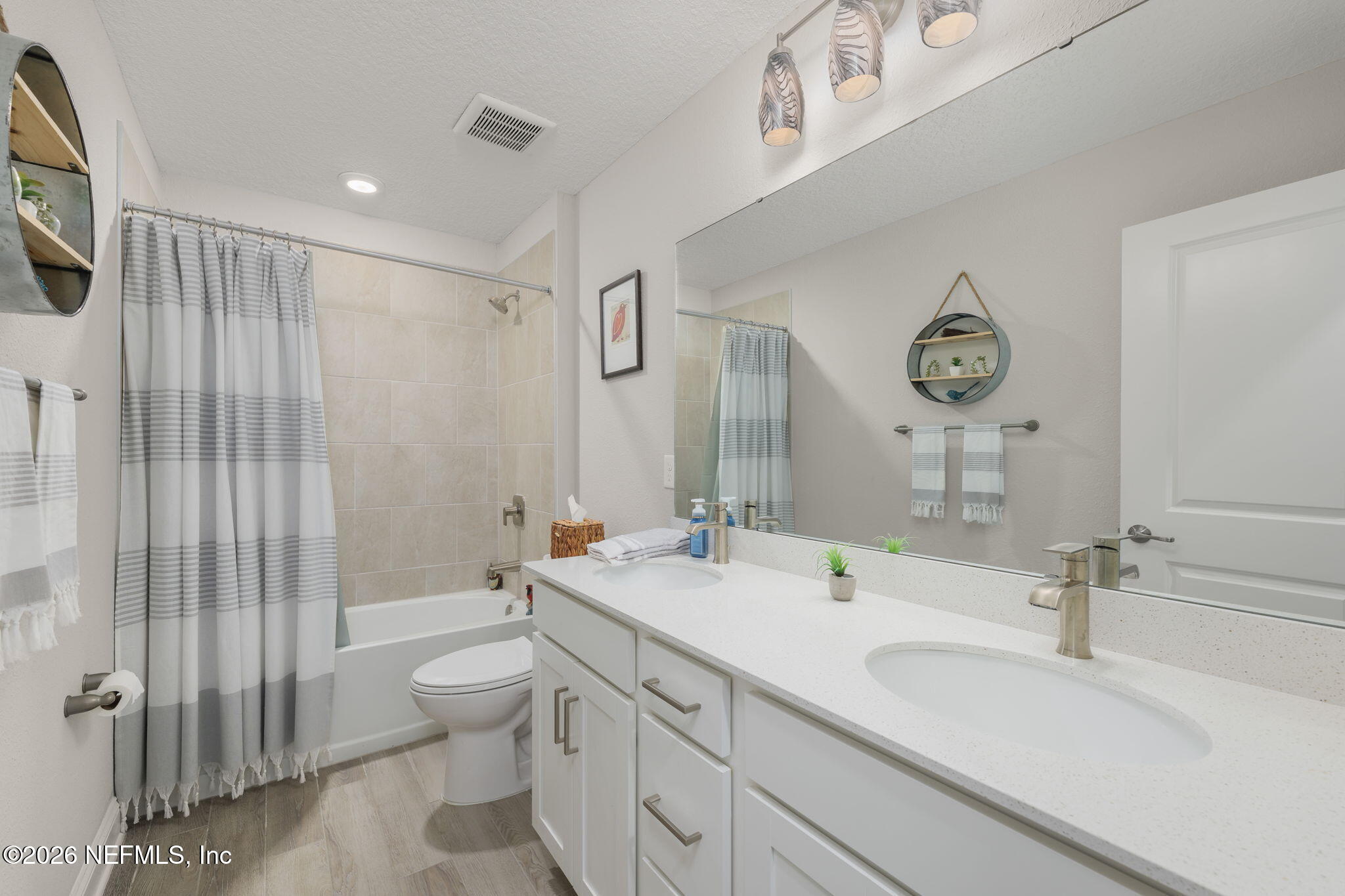 103 Riva Ridge Place St. Johns, FL 32259 - Photo 23 of 77 a bathroom with a double vanity sink mirror and toilet