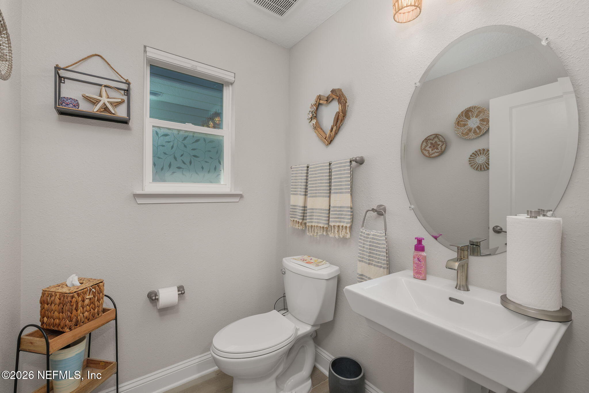 103 Riva Ridge Place St. Johns, FL 32259 - Photo 26 of 77 a white toilet sitting next to a bathroom sink