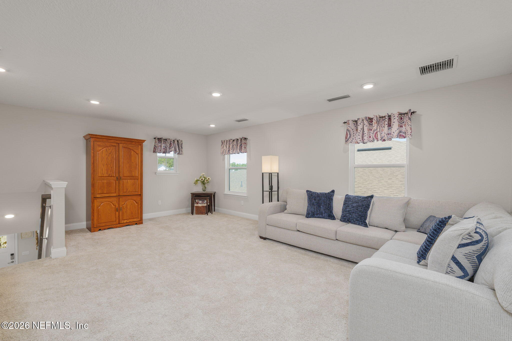 103 Riva Ridge Place St. Johns, FL 32259 - Photo 29 of 77 a living room with furniture and a couch