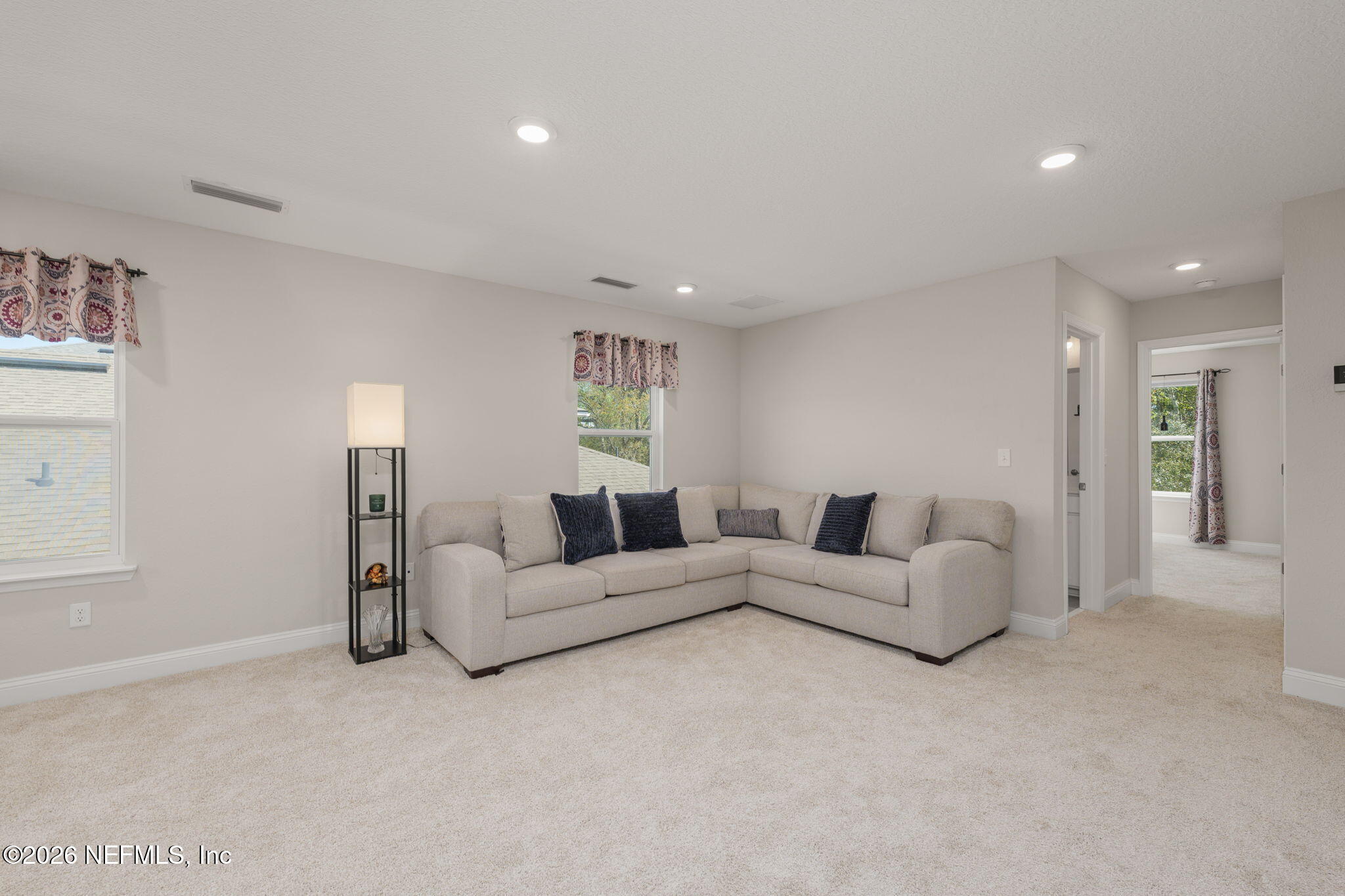 103 Riva Ridge Place St. Johns, FL 32259 - Photo 30 of 77 a living room with furniture and a couch