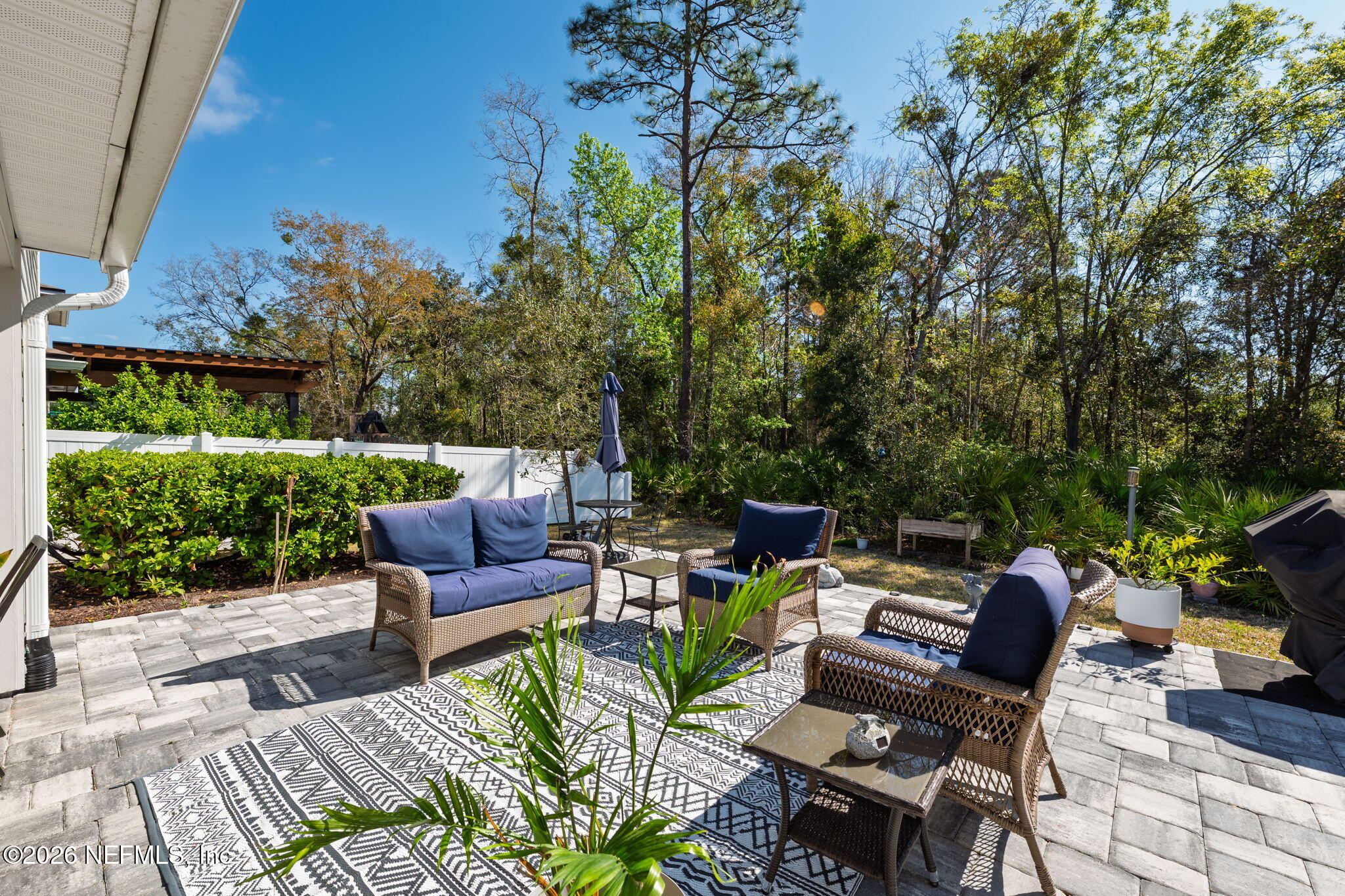 103 Riva Ridge Place St. Johns, FL 32259 - Photo 34 of 77 a view of a patio with couches chairs and a potted plants