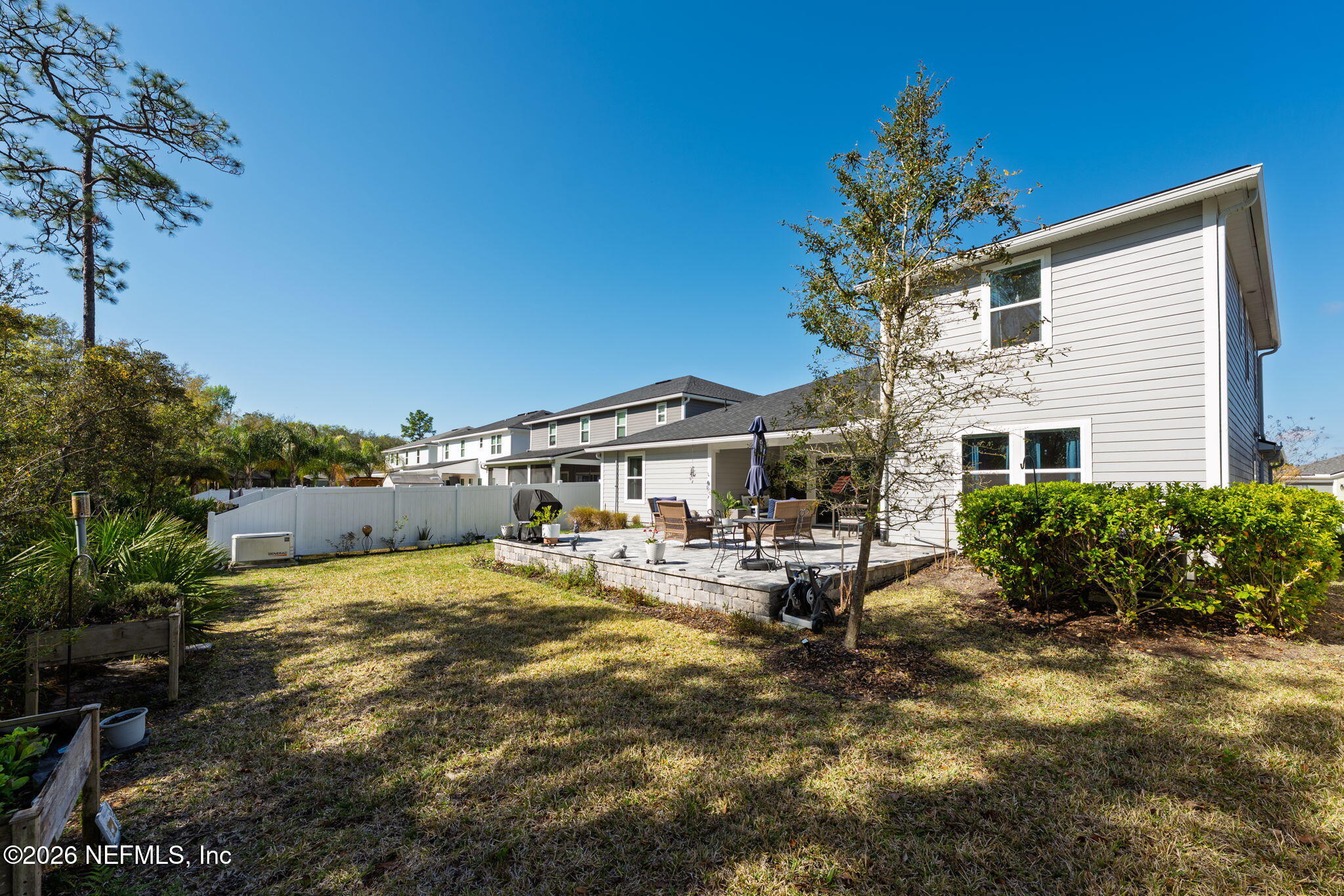 103 Riva Ridge Place St. Johns, FL 32259 - Photo 43 of 77 a view of a house with backyard sitting area and garden