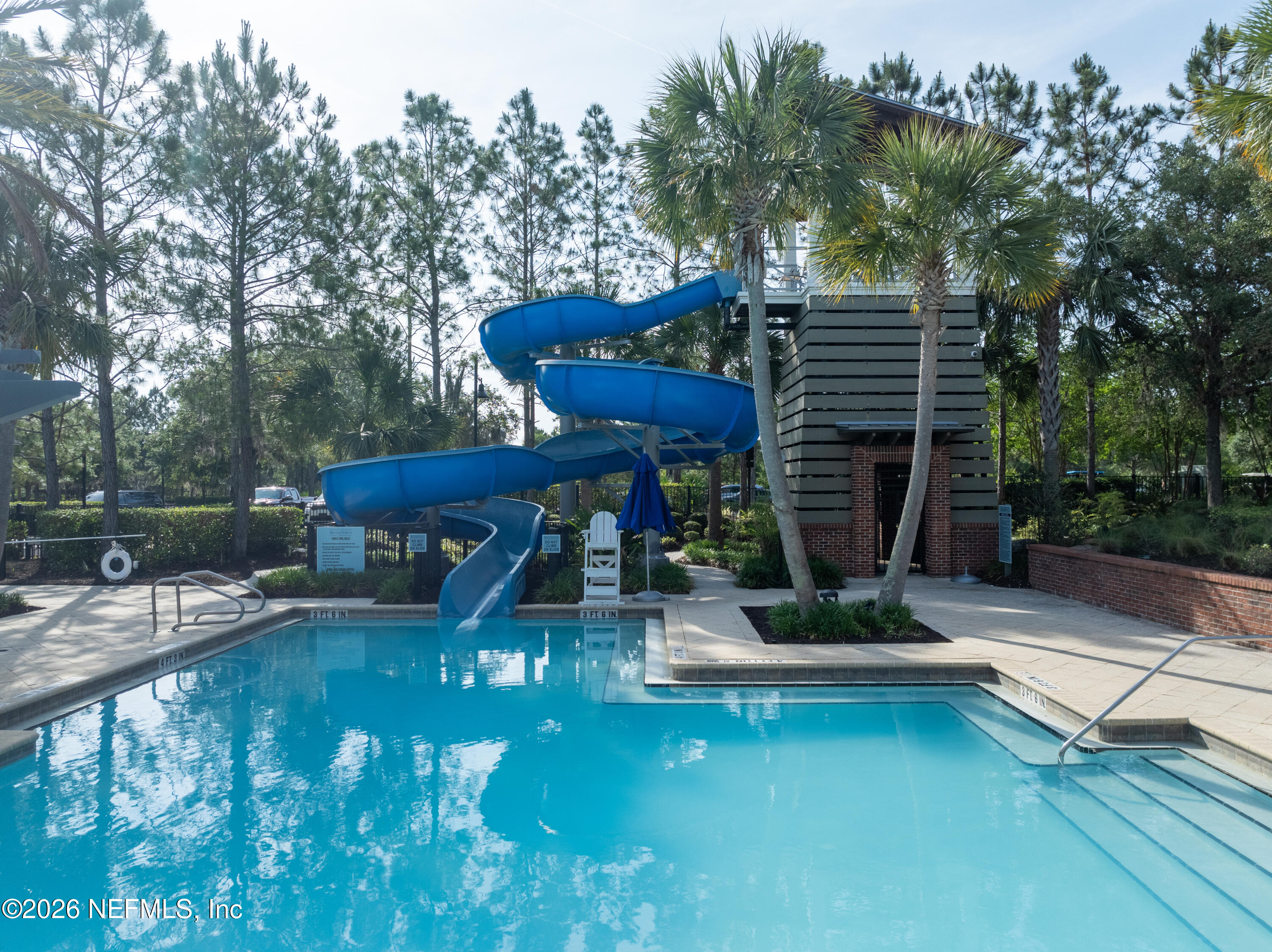 103 Riva Ridge Place St. Johns, FL 32259 - Photo 53 of 77 a view of a swimming pool with sitting area and slide